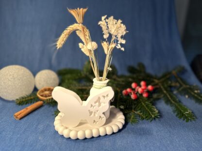 Schmetterling mit Blumenvase